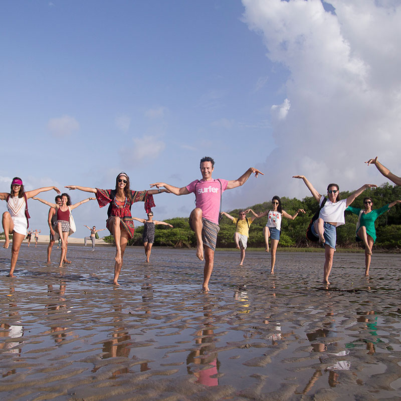 A group of people posing in a yoga position