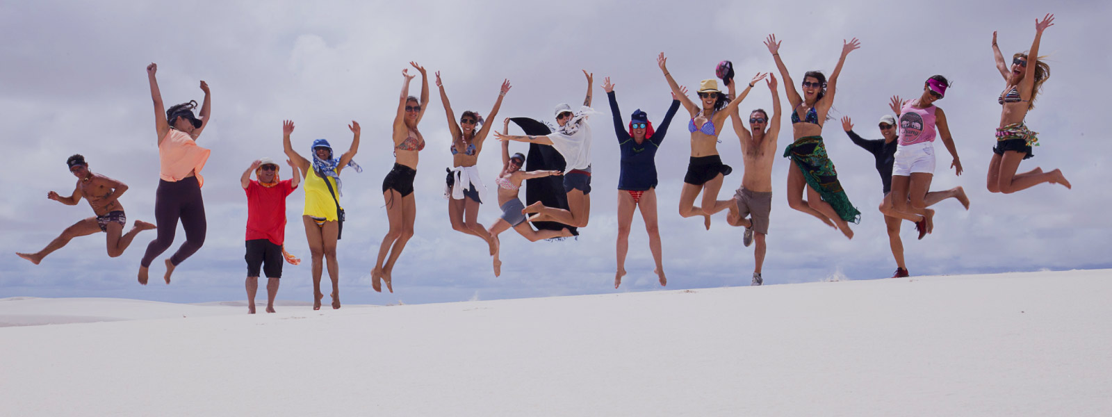 A group of guests jumping up for a photo
