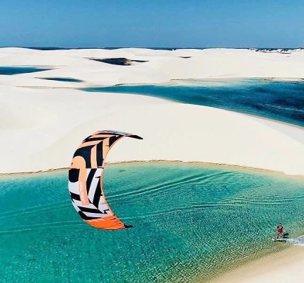 A Person kitesurfing on the dunes of Atins