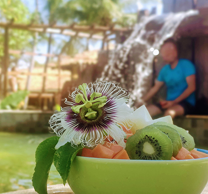 A bowl of fruits overlooking the pool in Convento Arcadia, Atins