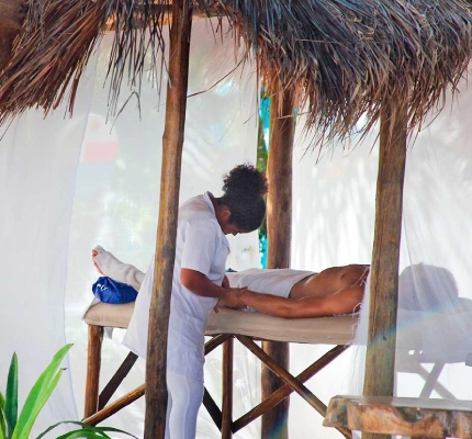 A man taking a massage at the spa in Convento Arcadia, Atins