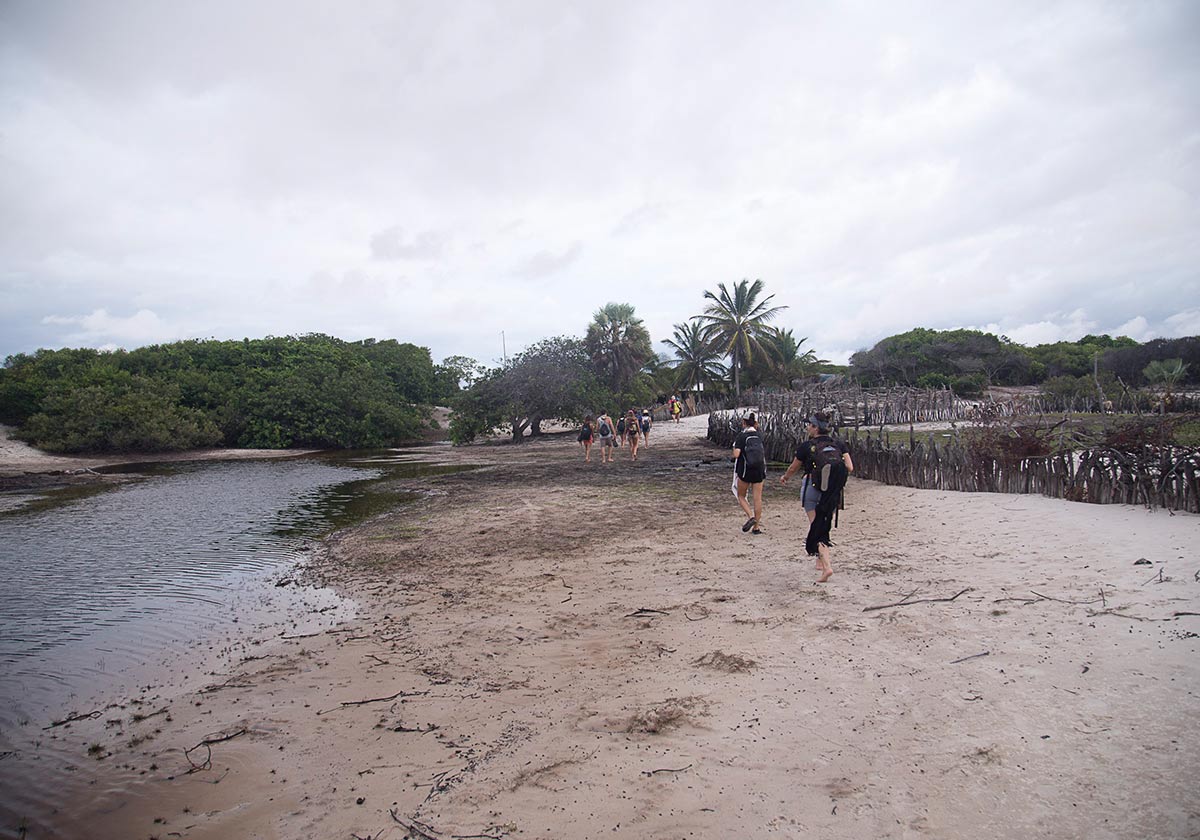 A group of people travelling across a lagoon