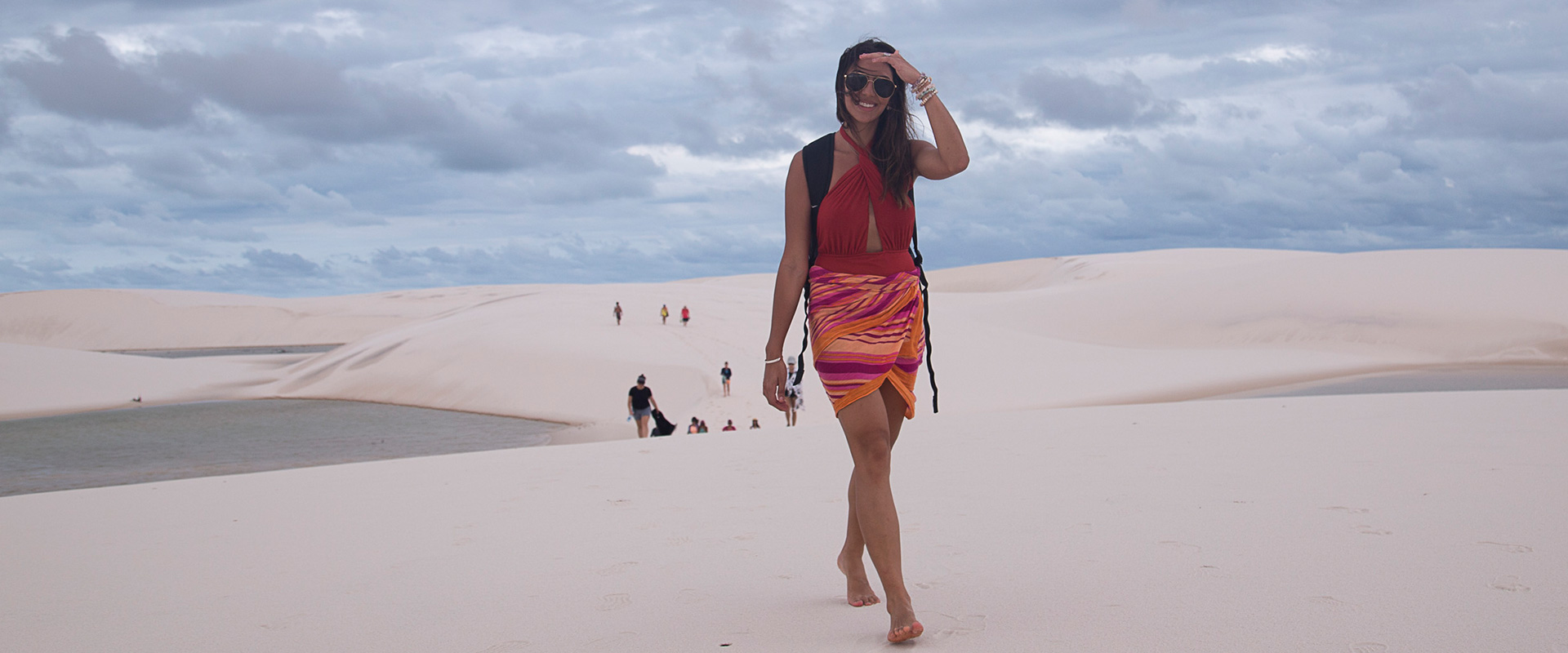 A lady posing for a picture on the Sand Dunes of Atins