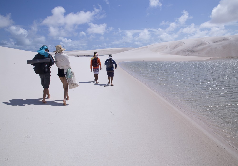 people walking in the beach