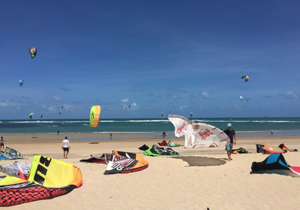 people kite surfing at beach