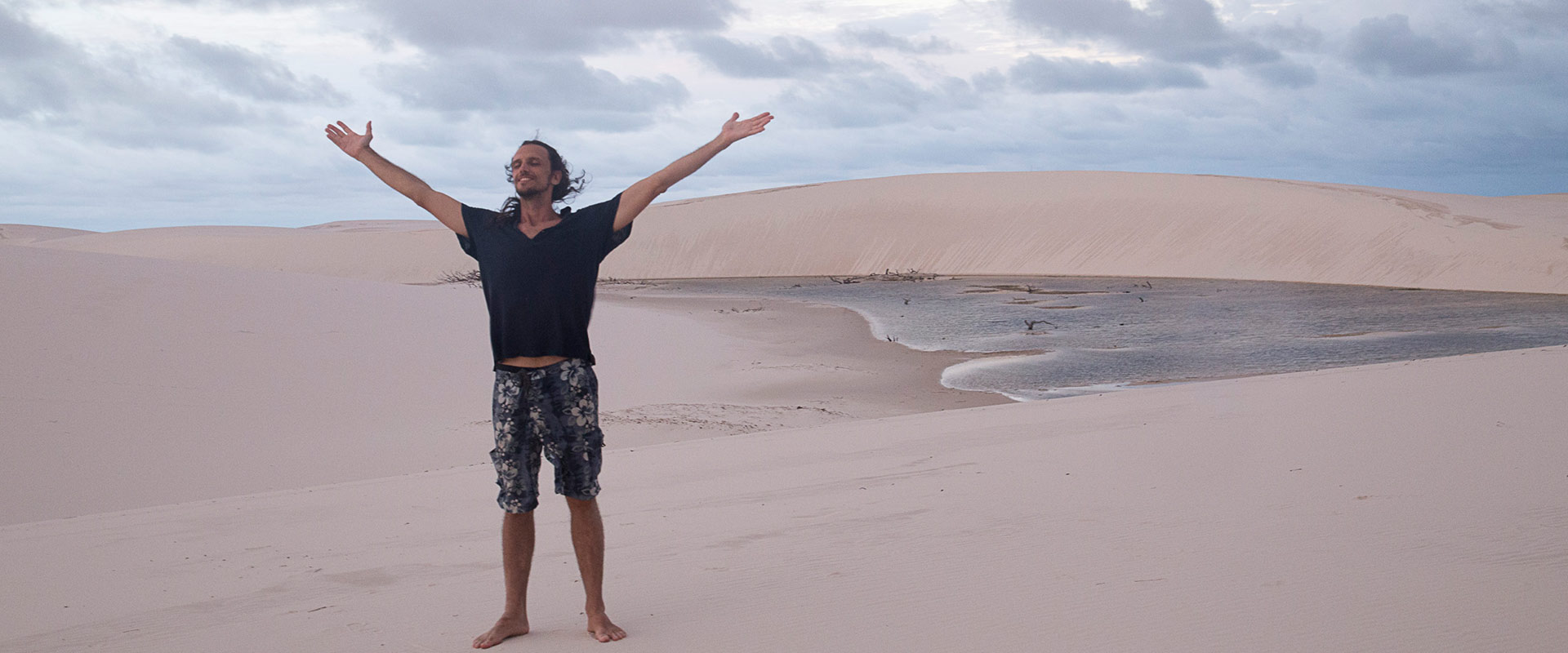 person enjoying the breeze at the beach