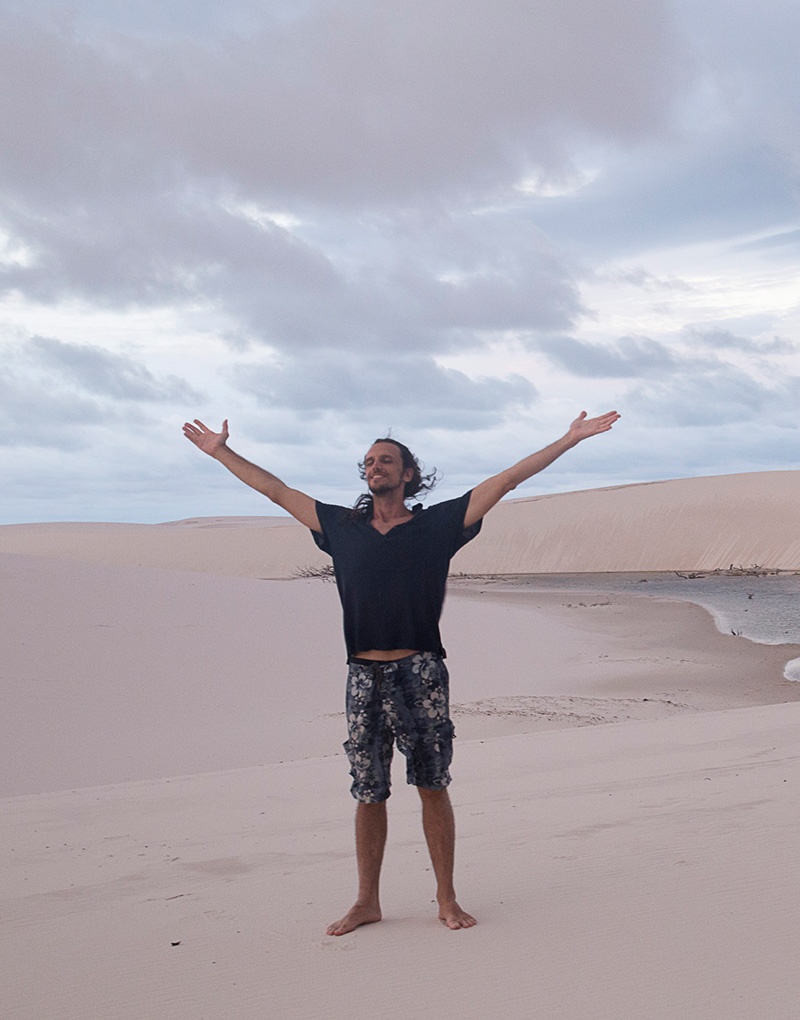 person enjoying the wind at the beach