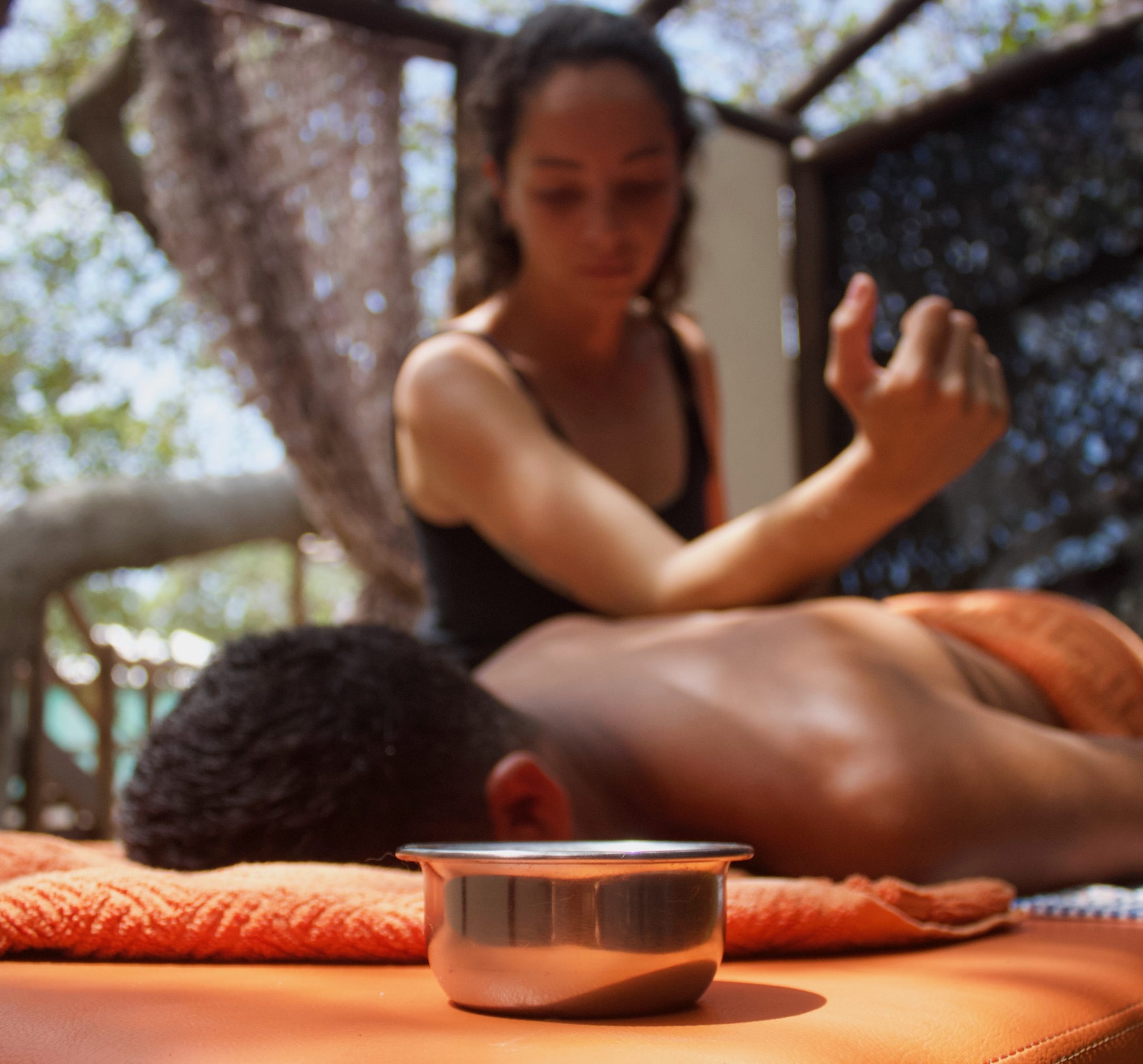 A man taking a massage at the spa in Convento Arcadia, Atins